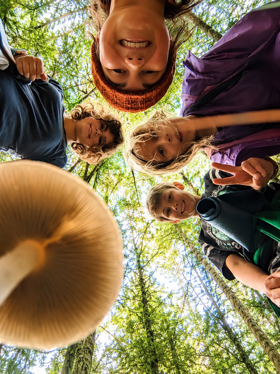 VISII students and an educator gathered together on a forest walk